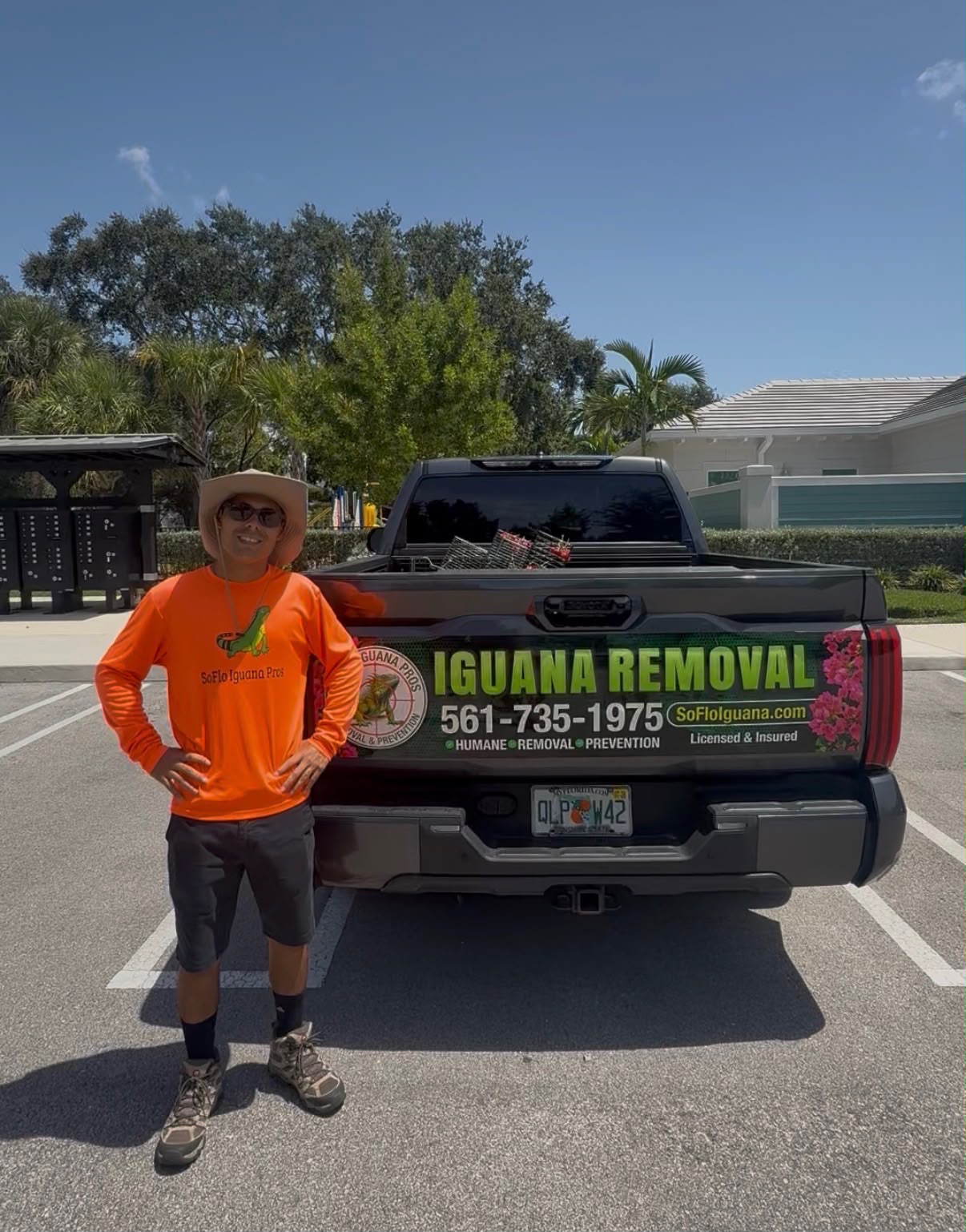 SoFlo Iguana Pros technician and service truck at a gated Palm Beach County community